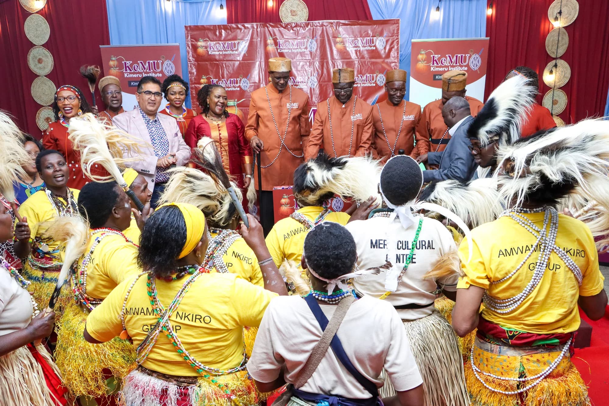 Cultural performers celebrating at the Kimeru Institute launch